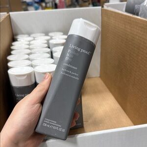 Living Proof Perfect Hair Day Conditioner in Gray and White